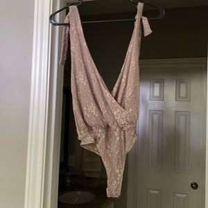 Free People Deep cut body suit.